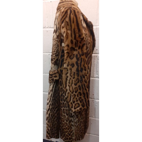 46 - A vintage ocelot fur coat, approx 40