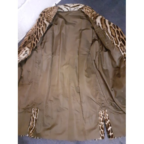 46 - A vintage ocelot fur coat, approx 40