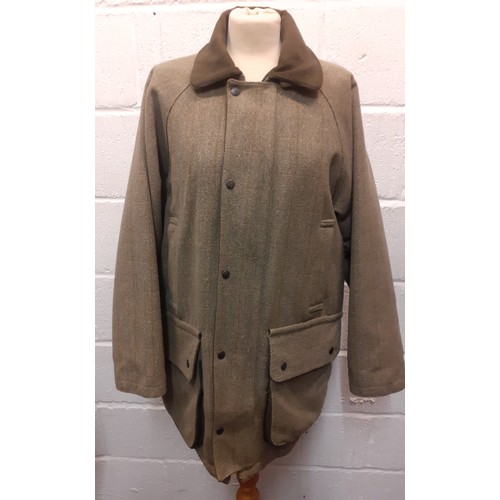 53 - A Bronte gents green Classic Countrywear coat, size Large, having a zip and press stud fastening, pa... 