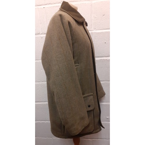 53 - A Bronte gents green Classic Countrywear coat, size Large, having a zip and press stud fastening, pa... 