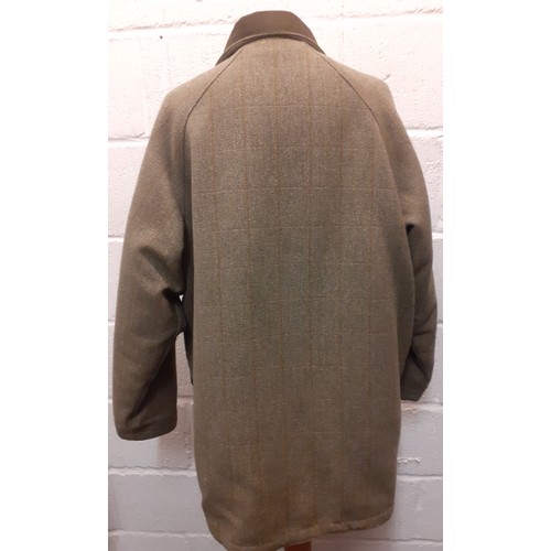 53 - A Bronte gents green Classic Countrywear coat, size Large, having a zip and press stud fastening, pa... 