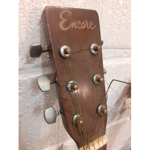 193 - Three classic guitars comprising an Encore TW350, a Narvaez Model 15 and another. Location:RWF
If th... 