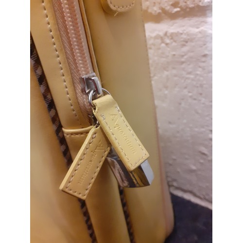 66 - Aquascutum-A vintage yellow weekend bag 50cm x 40cm with detachable shoulder strap and padlock. Loca... 