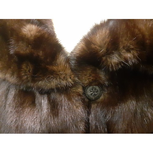 59 - A dark brown glossy mink coat with shawl collar and flared sleeves having 2 side pockets, approx 44