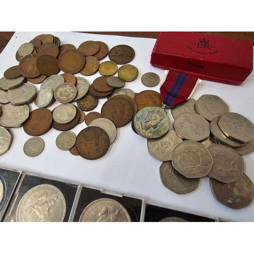 131 - A collection of British commemorative Crowns to include four 1935 Silver Jubilee Crowns and later ex... 