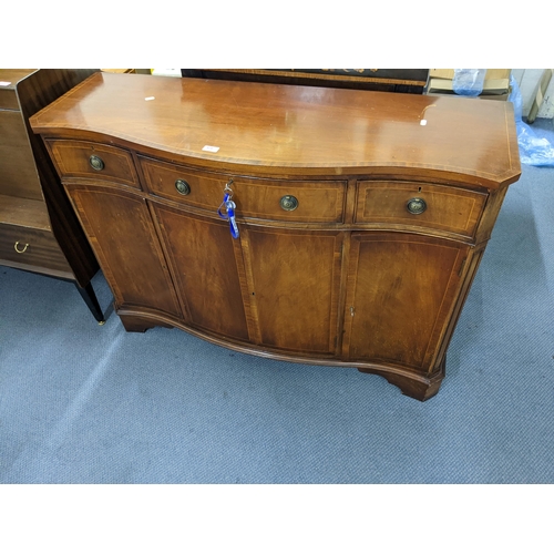 570 - reproduction inlaid mahogany serpentine front sideboard
Location:LAB
If there is no condition report... 