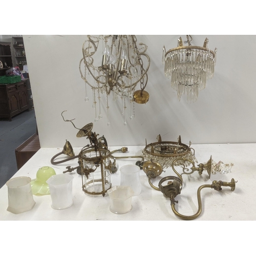 553 - A selection of brass and gilt coloured light fittings to include a pair of three waterfall chandelie... 