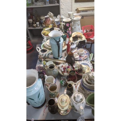 558 - A quantity of mixed ceramics to include a Doulton Lambeth pottery jug A/F, a variety of plates, teap... 