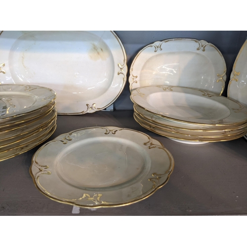 572 - A Crown Derby part dinner service to include meat plates, dinner plates, dishes and other items deco... 