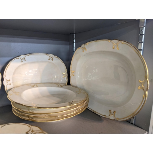 572 - A Crown Derby part dinner service to include meat plates, dinner plates, dishes and other items deco... 