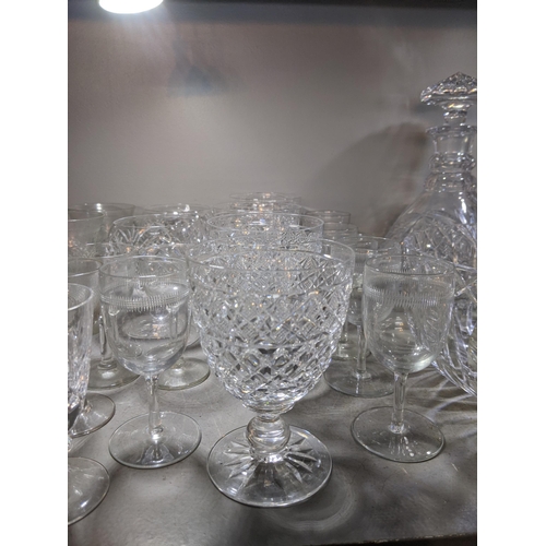 573 - Mixed cut crystal and glassware to include decanters, a crystal bowl, brandy balloons and other drin... 