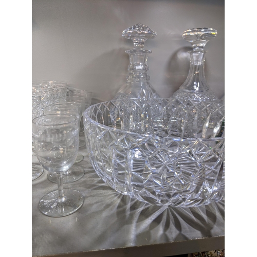 573 - Mixed cut crystal and glassware to include decanters, a crystal bowl, brandy balloons and other drin... 