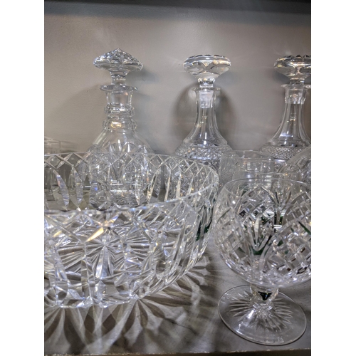 573 - Mixed cut crystal and glassware to include decanters, a crystal bowl, brandy balloons and other drin... 