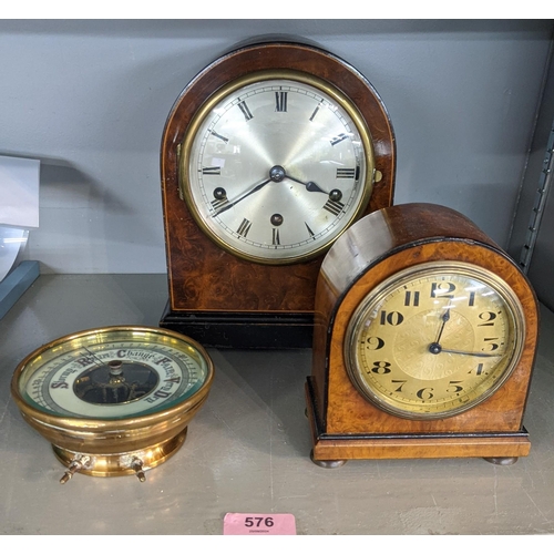 576 - Two early 20th century mantle clocks with domed tops, one faced with a Roman dial, the other with an... 