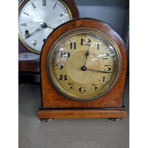 576 - Two early 20th century mantle clocks with domed tops, one faced with a Roman dial, the other with an... 