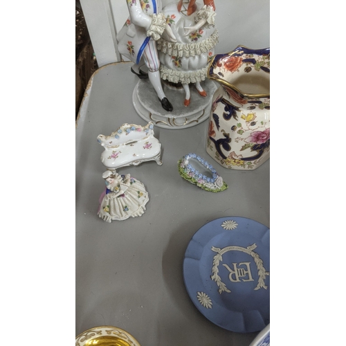 578 - A mixed lot to include a Meissen style figural group and others, along with a Wedgwood Jasperware as... 