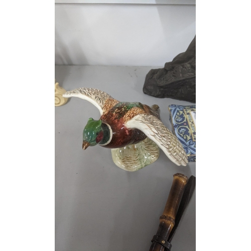 581 - A mixed lot to include a Beswick pheasant model 850, together with a Keith Lee sculpture of a miner,... 