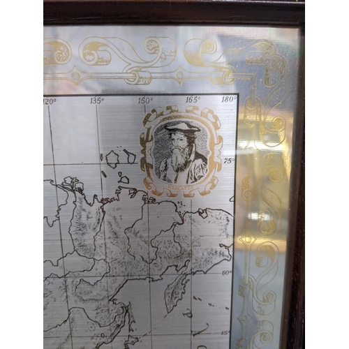 584 - A limited edition Royal Geographical Society silver map decorated with gold repeating design around ... 