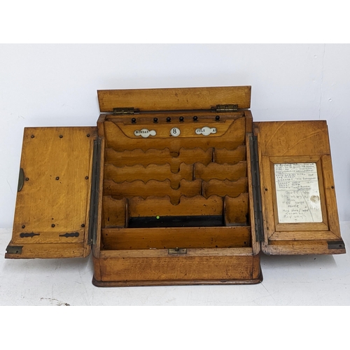 542 - A Victorian oak stationary box with calendar and open compartments below, space for two ink wells an... 