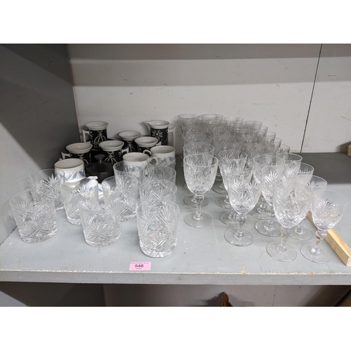 548 - A part suite of Webbs cut crystal table glass to include wines, whisky tumblers and sherries, along ... 