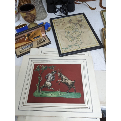 594 - A mixed lot of pictures and maps to include watercolours, a composition headed doll with blue grey s... 