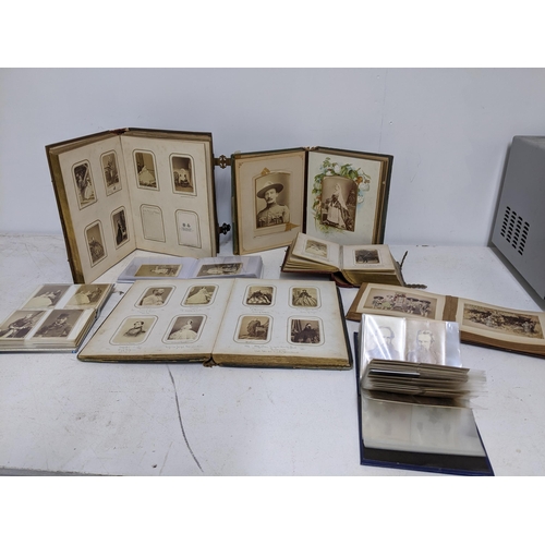 601 - A selection of seven Victorian and later photograph albums containing an extensive collection of Car... 