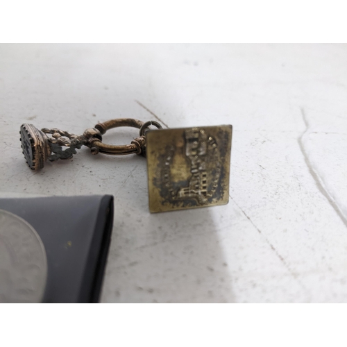 609 - Two Victorian/early 20th century fob seals on a gold coloured suspension ring, one depicting The Res... 