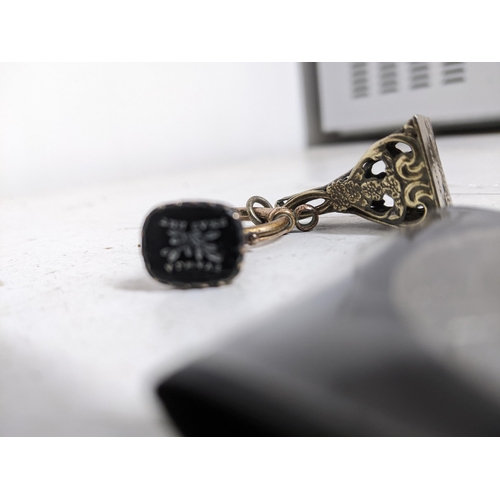 609 - Two Victorian/early 20th century fob seals on a gold coloured suspension ring, one depicting The Res... 