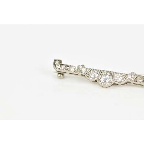 100 - Two brooches to include an Art Deco platinum diamond bar brooch set with sixteen diamonds, largest a... 