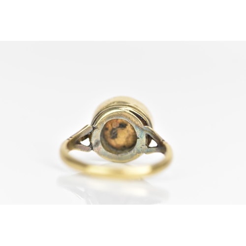 104 - A Victorian 18ct gold ring, set with a circular amethyst cabochon with diamonds overlapping in a cro... 