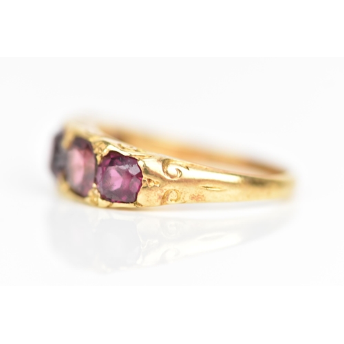 105 - A Victorian yellow gold ring set with five faceted cut amethysts graduating in size, the largest app... 