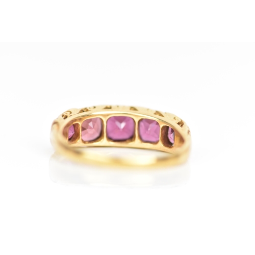 105 - A Victorian yellow gold ring set with five faceted cut amethysts graduating in size, the largest app... 