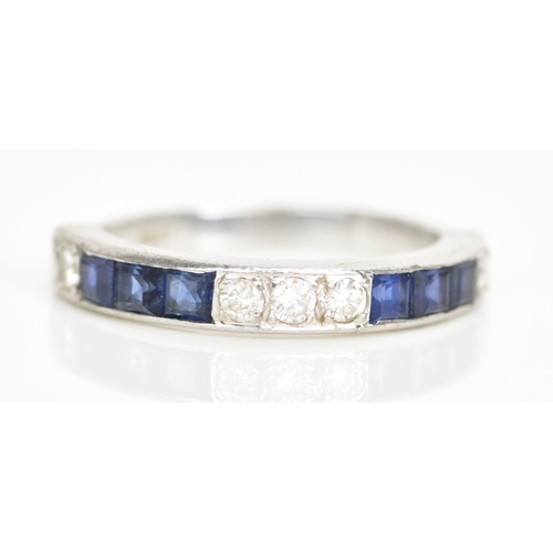 106 - An 18ct white gold half eternity, set with six square cut sapphires and five brilliant cut diamonds,... 