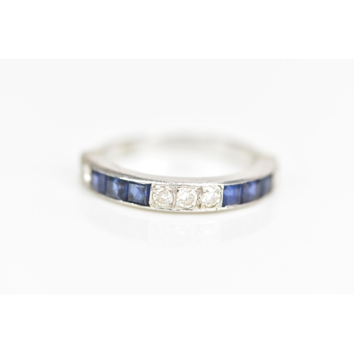 106 - An 18ct white gold half eternity, set with six square cut sapphires and five brilliant cut diamonds,... 