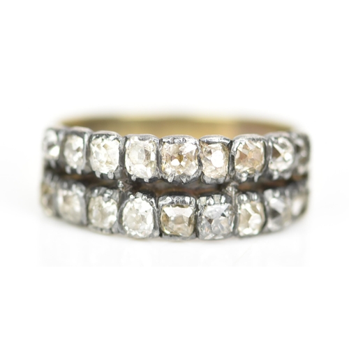 107 - A 19th century yellow metal diamond ring, set with two rows of eighteen old cut diamonds, ring size ... 