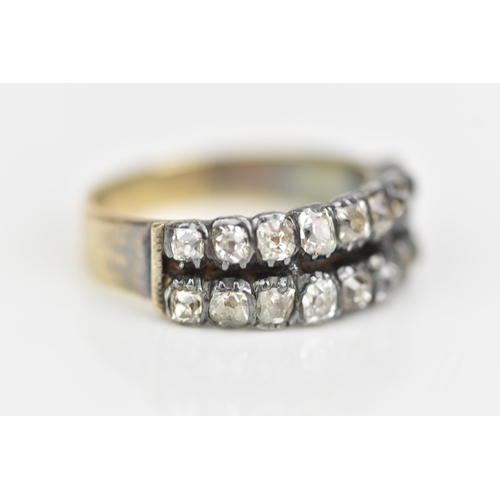 107 - A 19th century yellow metal diamond ring, set with two rows of eighteen old cut diamonds, ring size ... 