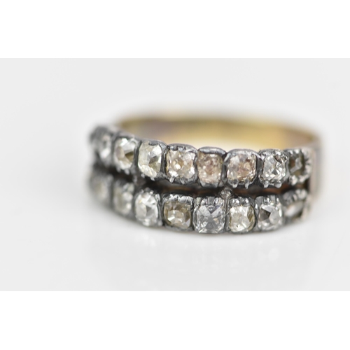 107 - A 19th century yellow metal diamond ring, set with two rows of eighteen old cut diamonds, ring size ... 