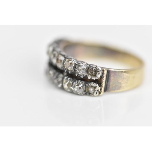 107 - A 19th century yellow metal diamond ring, set with two rows of eighteen old cut diamonds, ring size ... 