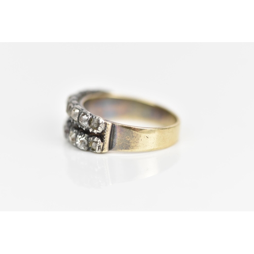 107 - A 19th century yellow metal diamond ring, set with two rows of eighteen old cut diamonds, ring size ... 