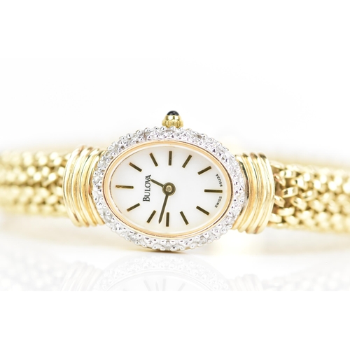 109 - A Bulova, quartz, ladies, 14ct yellow gold wristwatch, the white dial having gilt baton markers, sur... 