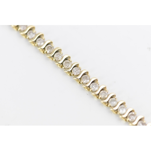 110 - A 14ct gold diamond tennis bracelet, with forty-six diamonds in claw settings, stamped 14K, each sto... 