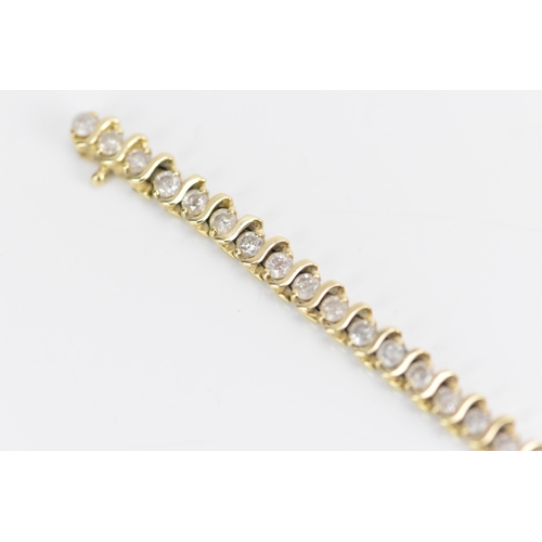 110 - A 14ct gold diamond tennis bracelet, with forty-six diamonds in claw settings, stamped 14K, each sto... 