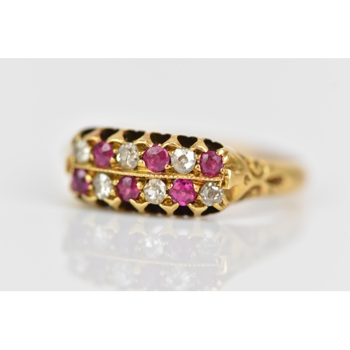 115 - A Victorian 18ct gold diamond and ruby ring, the twelve alternating stones inset into two rows and h... 