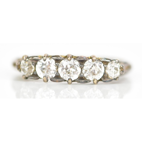 118 - A late Victorian/Edwardian five stone diamond ring, the brilliant cut diamonds in claw settings, lar... 