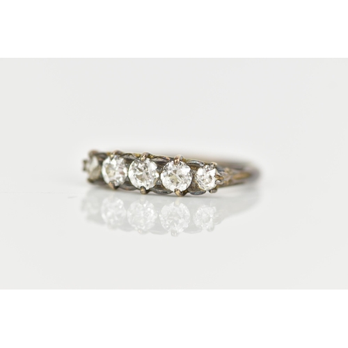 118 - A late Victorian/Edwardian five stone diamond ring, the brilliant cut diamonds in claw settings, lar... 