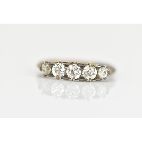 118 - A late Victorian/Edwardian five stone diamond ring, the brilliant cut diamonds in claw settings, lar... 