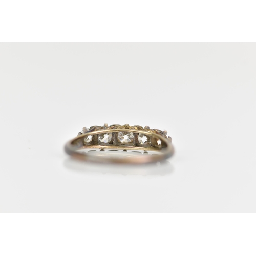 118 - A late Victorian/Edwardian five stone diamond ring, the brilliant cut diamonds in claw settings, lar... 