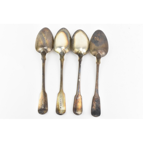 12 - Four Georgian silver table spoons, with various date marks and makers marks, each in the fiddle patt... 