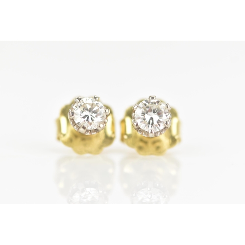 125 - A pair of 18ct yellow and white gold diamond earrings, each brilliant cut diamond 4.7mm, approx colo... 