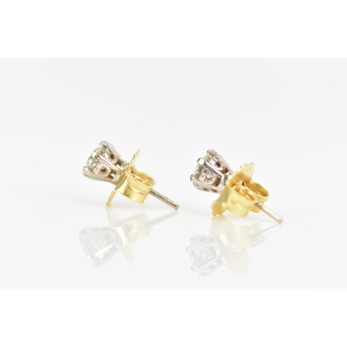 125 - A pair of 18ct yellow and white gold diamond earrings, each brilliant cut diamond 4.7mm, approx colo... 